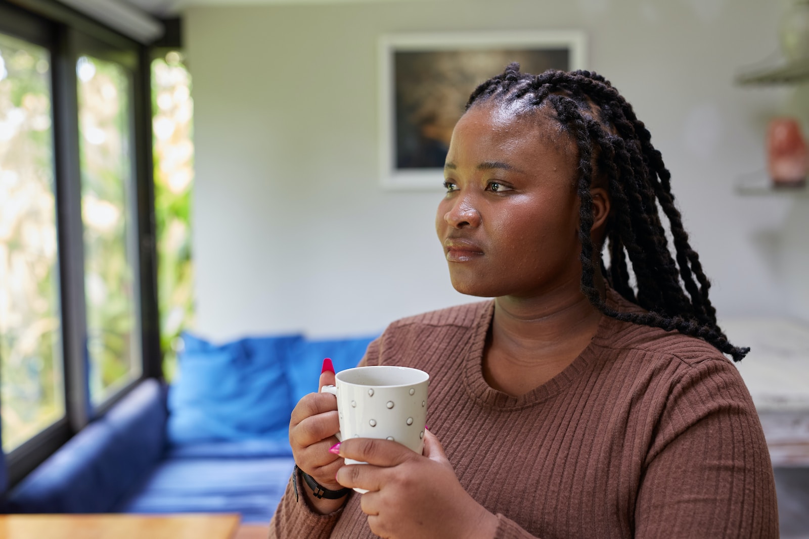 a woman holding a coffee cup in her hands