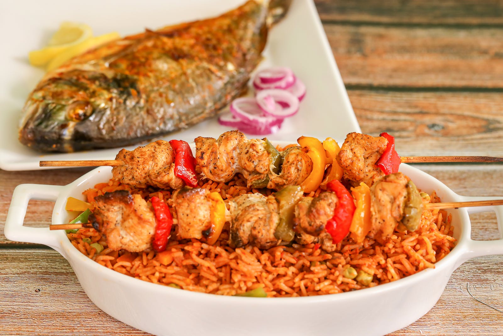 Fish with Jollof Rice, Chicken and Vegetables